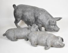 Large lead pig garden ornament and two piglets, largest L67 x H30cm