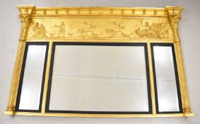 Regency gilt triptych bevelled glass overmantel mirror with relief moulded classical decoration,