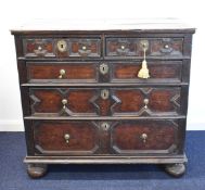 Carolean oak / elm chest of two over three graduated drawers raised on bun feet, W100 x D54 x H92cm