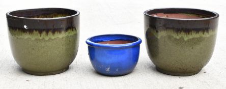 Two green glazed jardinières and a blue example, tallest 32cm