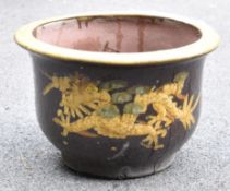 Large glazed terracotta planter or jardinière and decorated with embossed dragon motifs W48 x H34cm