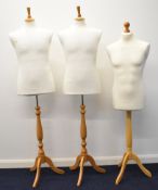 Three torso mannequins raised on wooden stands, H154