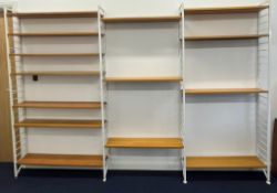 Ladderax wall unit with four uprights and fourteen teak shelves, W292 x D21 x H202cm