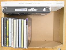 Thirteen Genesis CDs including two box sets.