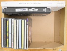 Thirteen Genesis CDs including two box sets.