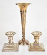 Pair of Millennium hallmarked silver squat candlesticks, together with a hallmarked silver trumpet