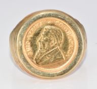 A 9ct gold ring set with a 1994 1/10th Kruggerand, 10.6g, size U