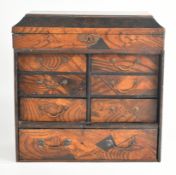 Japanese Meiji period twin handled apothecary chest with fall flap lid and an arrangement of seven