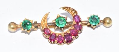 Victorian yellow metal brooch in the form of a crescent and stars set with spinel and green paste,