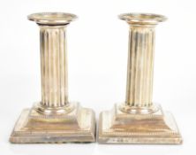 Pair of Victorian hallmarked silver candlesticks with reeded columns, Sheffield 1897, maker