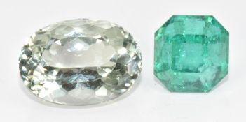 A loose emerald cut emerald of approximately 4.2ct and a loose oval cut quartz of approximately 6.