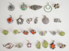 Nineteen silver pendants set with emeralds, sapphires, rubies, peridot, etc and three pairs of