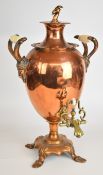 19th/20thC Arts & Crafts copper samovar with twin goat mask handles, goat finial and ceramic mounts,