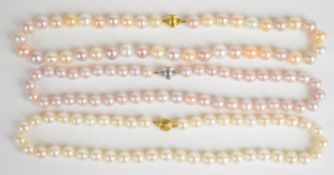 Three strands of cultured pearl necklaces with silver clasps