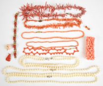 A 14k gold pendant set with a carved coral rose, 14k gold earrings set with coral, beaded coral