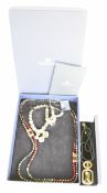 Four pieces of Swarovski jewellery including matching necklace and bracelet and two necklaces, in