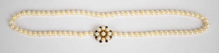 A single strand of cultured pearls with 9ct gold clasp set with cultured pearls and garnets, 36.
