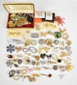 Over seventy vintage brooches including Ciro spider, Sphinx, Exquisite, silver Celtic design, etc