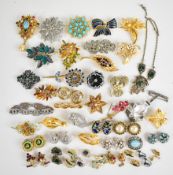 A collection of vintage brooches including Monet, Art Deco, Jewelcraft, Christian Dior, Avon,