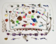 A collection of jewellery including seven pairs of silver earrings, five silver pendants, silver