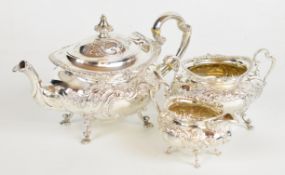 Victorian hallmarked silver three piece bachelor's teaset with embossed decoration and Rococo scroll