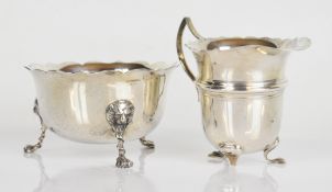 Edward VII hallmarked silver sugar bowl with shaped edge, raised on three lion mask and paw feet,