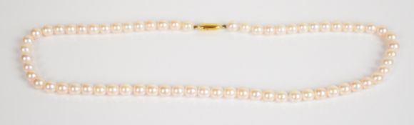 A single strand of cultured pearls with yellow metal clasp (tests as 18k gold), 23.6g, 41cm, each