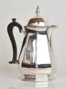George V hallmarked silver hot water jug of bulbous octagonal form, Sheffield 1923, maker