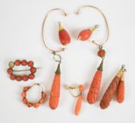 A pair of Victorian earrings and four Victorian pendants, all set with carved coral, with two single