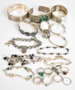 A collection of silver jewellery including bangle with engine turned decoration, malachite bangle,