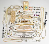 A collection of costume jewellery including diamanté necklace, bracelet and brooches, faux pearls,