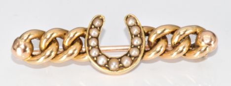 A 14ct gold brooch in the form of a horseshoe set with split pearls, 4.4g, 4cm