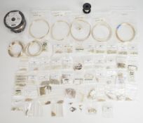 A collection of silver jewellery making clasps, chain, wire, earring backs, etc