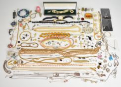 A collection of silver jewellery including bangle, chains, earrings, pendants, etc together with