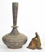 Bergman style bronze figure of a carpet seller and a brass cloisonné / enamelled covered vase,
