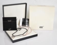 Montblanc silver star pendant set with a diamond, in original box with two satin necklaces