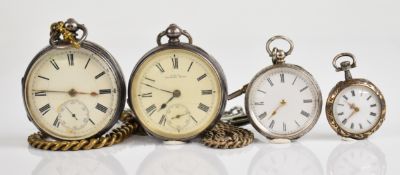 Four silver pocket watches including a Waltham and two with ornate engraving, three of the four on