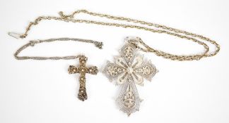 Two filigree crosses on chains, the smaller of which tests as 900 grade silver and the larger 930