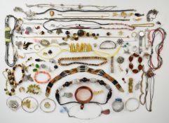 A collection of jewellery including silver butterfly pendant, three silver bangles, silver