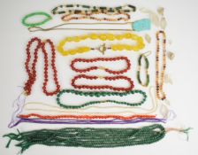 A collection of beaded necklaces including amethyst, aventurine quartz, carnelian agate,