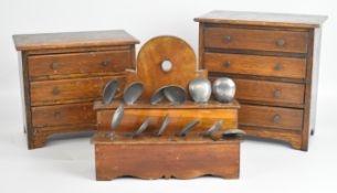 Two oak apprentice chests, the largest W28 x D17 x H29cm and a Welsh style pipe rack currently