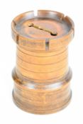 18/19thC treen moneybox in the form of a castle or keep, with turned decoration, castellated top and