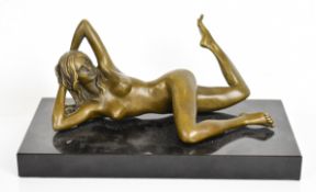 Erotic bronze figure of a nude reclining woman, on a marble base, signed J Mavchi to  lower back,