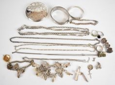 A collection of silver jewellery including two charm bracelets with over fourteen charms including
