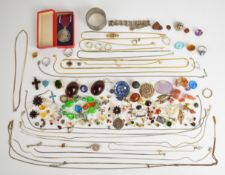 A collection of silver jewellery including a cross set with enamel, St Christopher, locket on chain,
