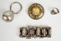 A collection of jewellery including Miracle brooch, silver ring (unmarked), bracelet and rattle