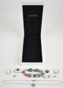 A collection of silver Pandora jewellery including bracelet with eleven Pandora charms and other