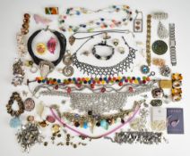 A collection of jewellery including beaded necklaces, cufflinks, tie clips, rings, etc