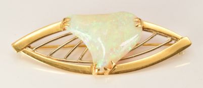 An 18ct gold brooch set with a white opal cabochon, 8.4g, 5.2cm