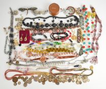 A collection of vintage jewellery including necklaces, brooches, silver coins etc